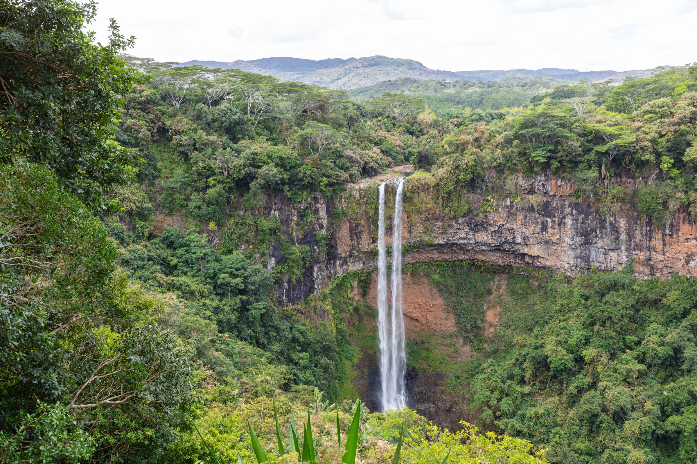 The Chamarel waterfall dropping into a forested gorge on the edge of the central plateau