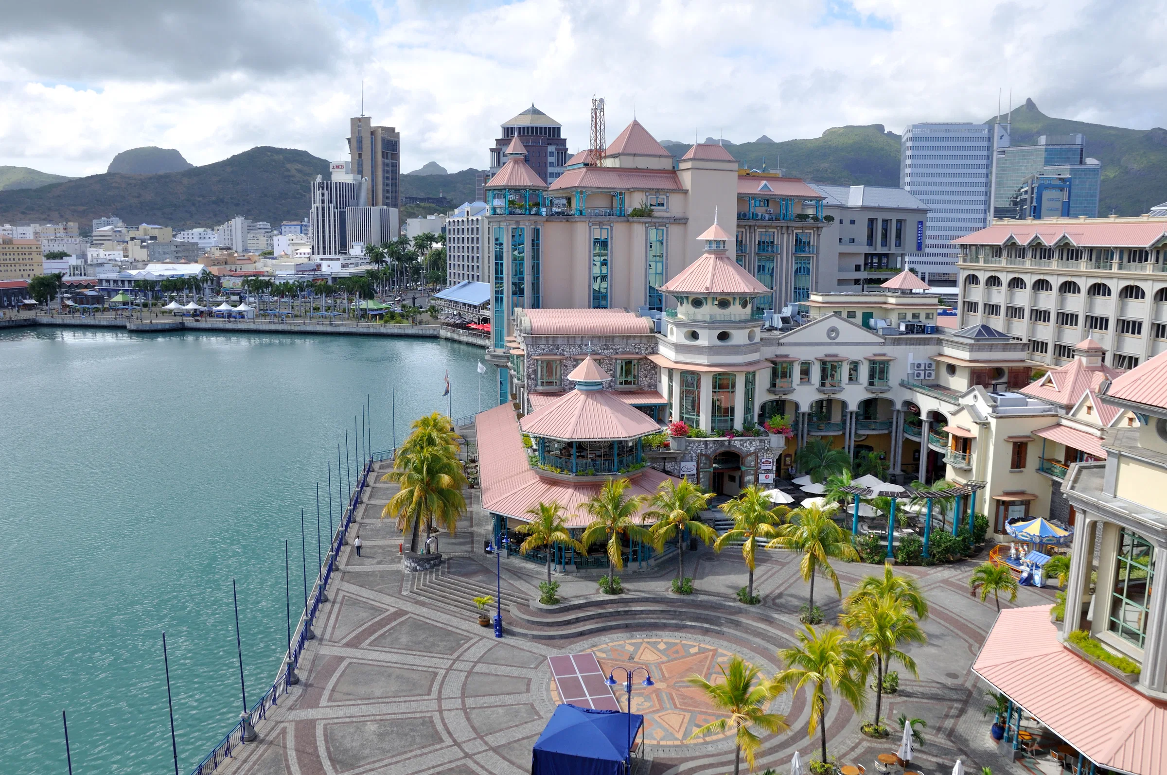 Le Caudan Waterfront and the Port Louis skyline, with the mountains behind