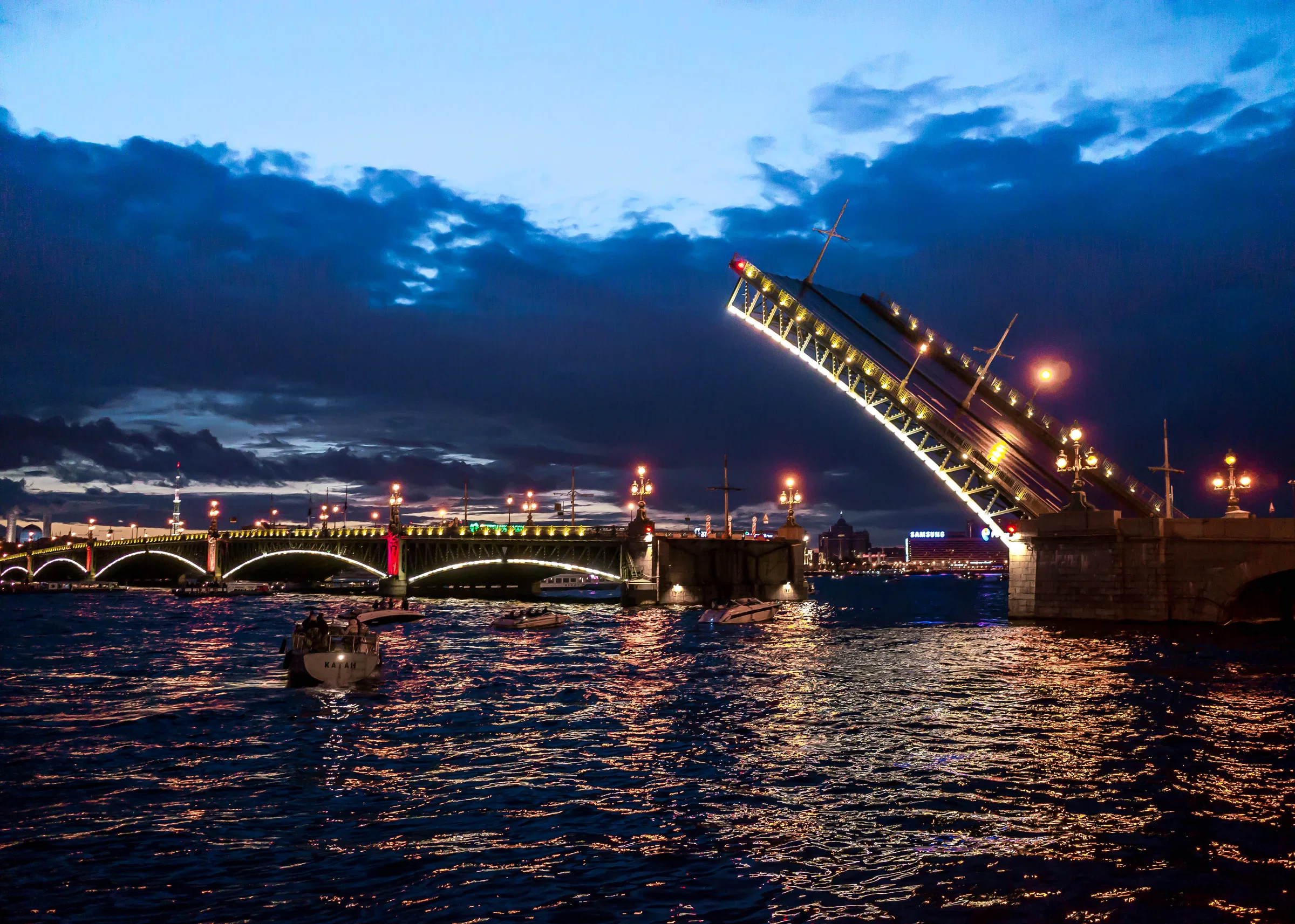 A drawbridge raised over the Neva in Saint Petersburg under the pale sky of a White Night