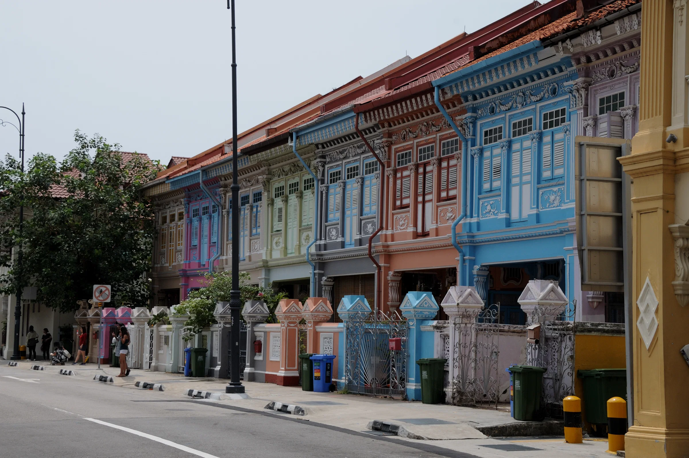 A row of pastel Peranakan shophouses with ornate facades along Koon Seng Road in Joo Chiat