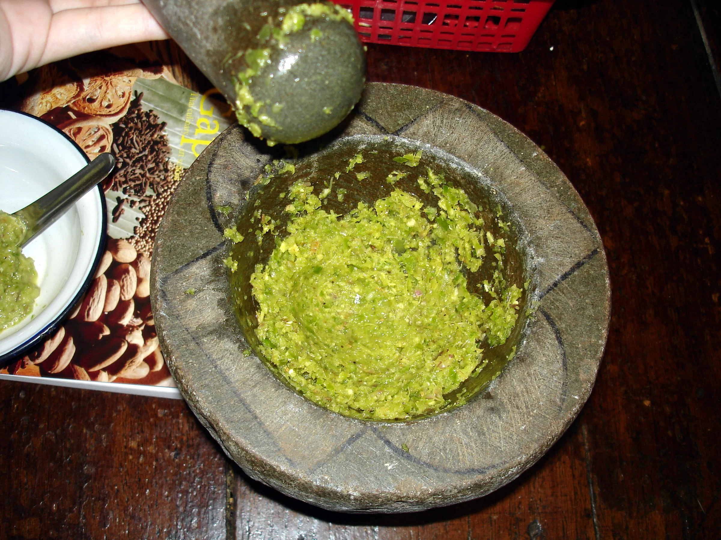 Fresh Thai green curry paste in a stone mortar