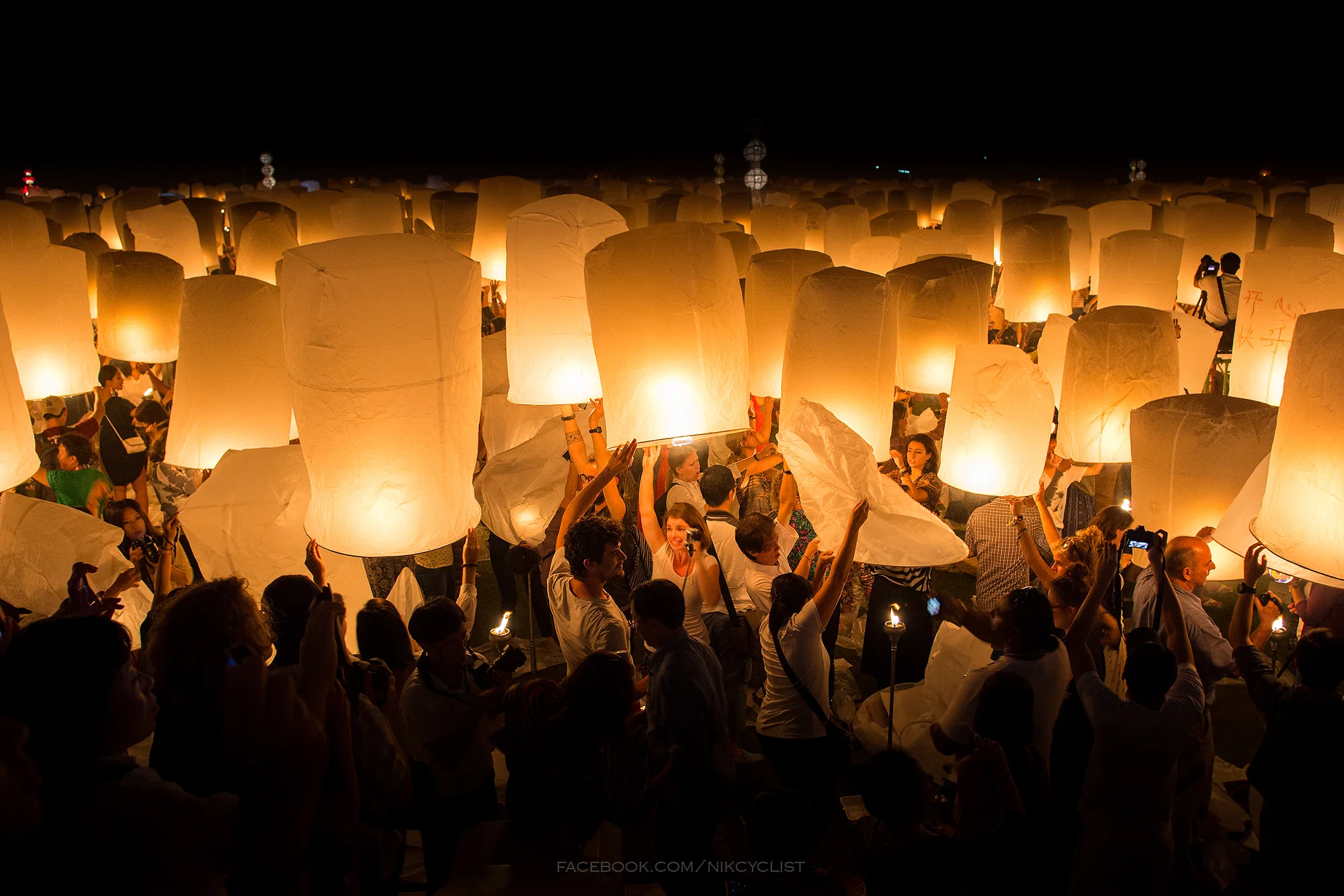 Sky lanterns rising at the Yi Peng festival near Chiang Mai