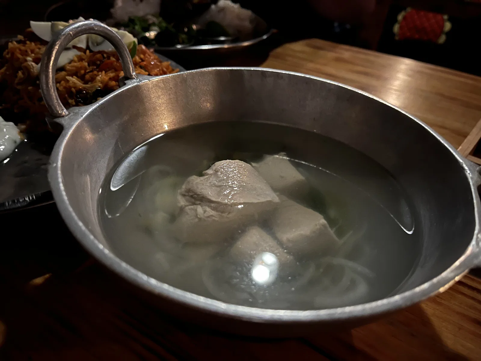 A pot of garudhiya, clear tuna broth with pieces of fish