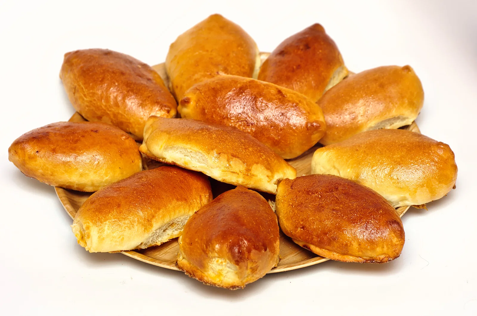 A plate of golden baked pirozhki