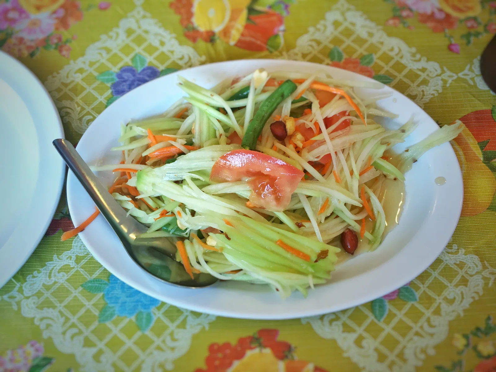 Som tam, green papaya salad pounded with lime, palm sugar, chilli and peanuts