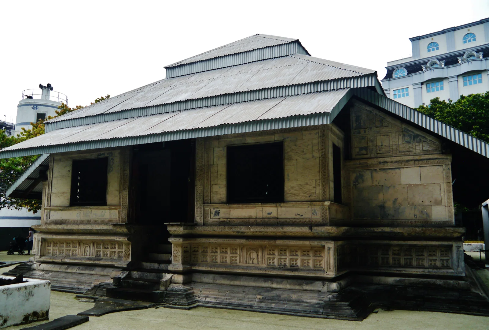 The coral-stone Old Friday Mosque in Malé, with its carved walls and pitched roof